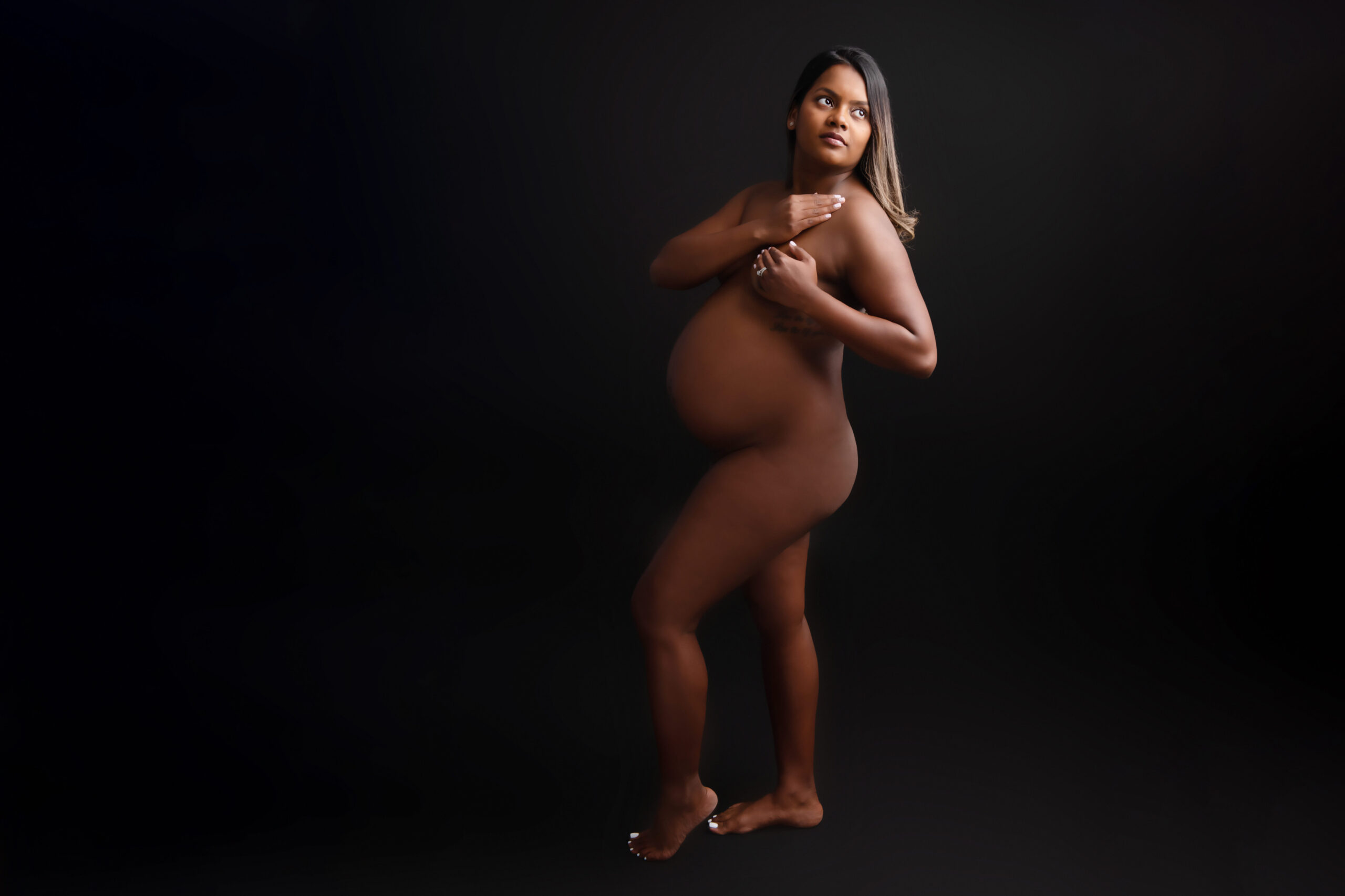 African American pregnant woman naked for her Boudoir Maternity Photography Session Burlington Ontario.